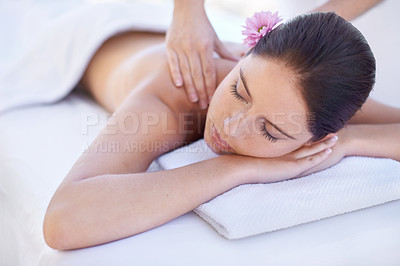 Buy stock photo Relax, massage and woman at spa with flower for health, wellness and luxury holistic treatment. Self care, peace and girl on table with masseuse for body therapy, sleep and rest with hotel service