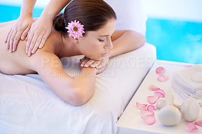 Buy stock photo Wellness, massage and woman at spa pool with flower for health, relax and luxury holistic treatment. Self care, peace and girl on table with masseuse for body therapy, sleep and calm hotel service