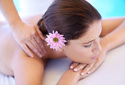 Buy stock photo Rest, massage and woman at spa with flower for health, wellness balance and luxury holistic treatment. Self care, peace and girl on table with masseuse for body therapy, relax and calm hotel service