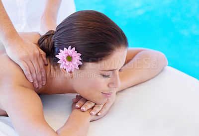 Buy stock photo Shot of an attractive young woman,getting a back massage at a spa