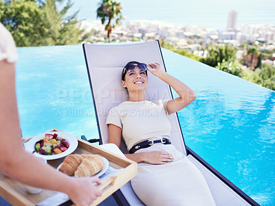 Buy stock photo Hotel, pool and woman with luxury breakfast for business trip, smile and relax with rooftop service. Travel, hospitality and happy businesswoman on lounge chair for brunch, sunshine and villa holiday