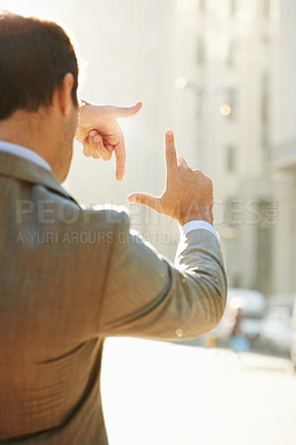Buy stock photo Hands, frame and focus with man in city for vision, building and thinking with mockup. Inspiration, planning and idea with male employee and finger gesture for freedom, motivation and insight 
