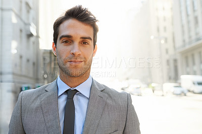 Buy stock photo Shot of a well-dressed young businessman in the city
