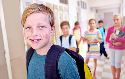 Buy stock photo Student, portrait and kid with smile in hallway with education, study and backpack for back to school. Youth, young boy and learning with friends on campus with children and happy in a corridor