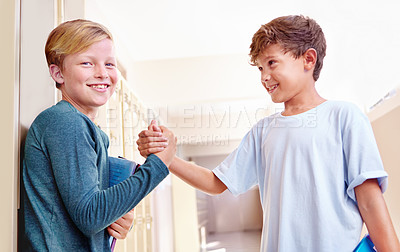 Buy stock photo Friends, portrait and smile with student handshake greeting in hallway with education, study and back to school. Youth, boys and kids with learning on campus with children happy from class fun