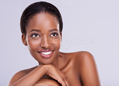 Buy stock photo Cropped shot of an attractive young woman touching her skin