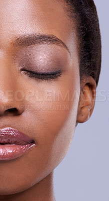 Buy stock photo Half, face and makeup, black woman with beauty and healthy glow, natural cosmetics for wellness on grey background. Eyes closed, peace and calm for dermatology, antiaging and skincare in studio