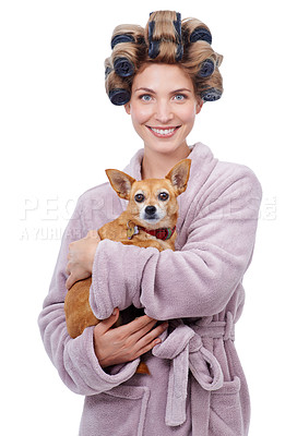 Buy stock photo Portrait of a happy young woman holding her dog while standing in a bathrobe