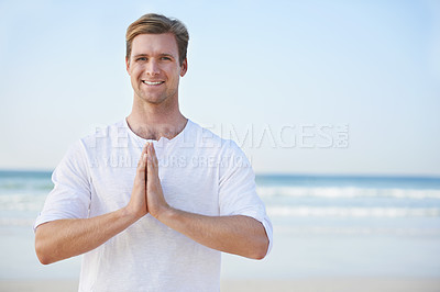 Buy stock photo Man, yoga and beach with smile in portrait for peace, zen and space for mockup on vacation with meditation. Person, ocean and outdoor in summer for namaste with nature on spiritual journey by sea