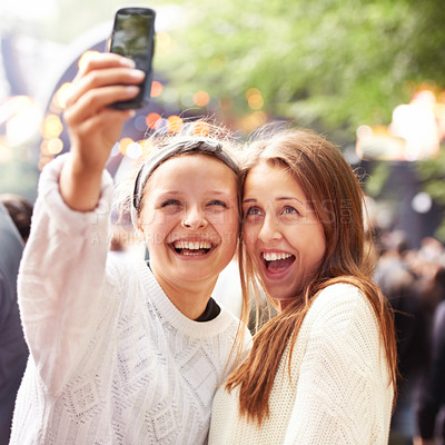 Buy stock photo Friends, women and selfie and music festival for happy memory and social media outdoor at event. Excited people in a profile picture or photography at concert, event or holiday party for celebration