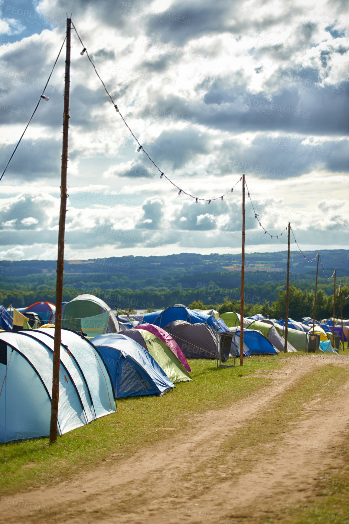 Buy stock photo Camping, tents and outdoor music festival in park for celebration on holiday vacation in summer. Campsite, background or shelter at party, event or travel in nature for concert or crowded carnival