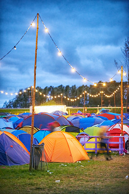 Buy stock photo Shot of a large group of tents at an outdoor festival