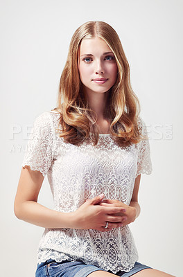 Buy stock photo Fashion, beautiful and portrait of a woman in a studio with a casual, trendy and stylish outfit. Smile, confidence and young female model with style posing on a chair isolated by a white background.