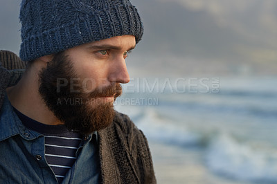 Buy stock photo Cropped shot of a bearded man standing on the beach