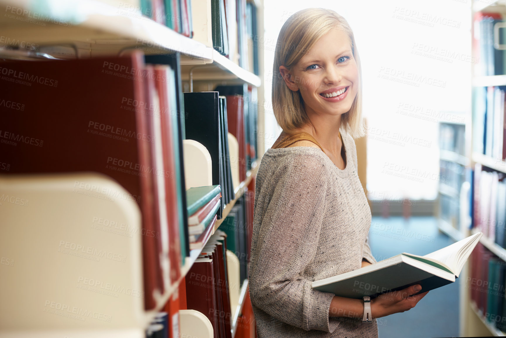 Buy stock photo Woman, portrait and book in library for reading as student for university education, scholarship or knowledge. Female person, face and research for revision or Canada for lesson test, exam or degree