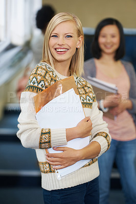 Buy stock photo University student, smile and portrait in lecture with paperwork for studying, academic or development. Female person, face and test document for USA campus or education project, exam or scholarship