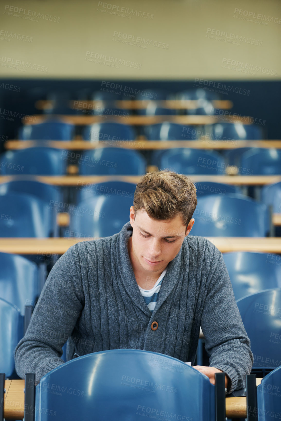 Buy stock photo Writing, college and man student in classroom brainstorming for exam studying ideas. Planning, education and young male person in lecture hall with question for university assignment at academy.