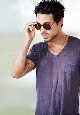 Buy stock photo Fashion, sunglasses and man outdoor with confidence, cool style and pride in Miami. Summer, holiday and person with serious face in casual outfit for vacation in Florida and relax in sunshine