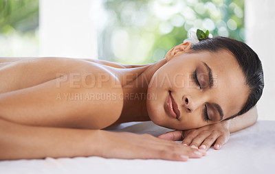 Buy stock photo Relax, peace and woman at spa for skincare, massage and calm at table to rest for zen at luxury resort. Beauty, therapy and young person at salon for healthy body, treatment and pamper for wellness