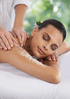 Buy stock photo Woman, massage and body scrub in spa, detox and cosmetic sugar treatment for skin care in salon. Person, relax or cosmetology by masseuse for dead cells, calm or wellness with healing hands on bed