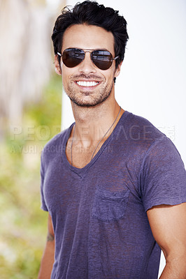 Buy stock photo Cropped view of a trendy young guy smiling while wearing shades