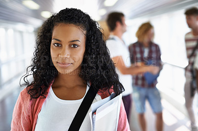 Buy stock photo Portrait of an attractive young student standing with her friends in the background