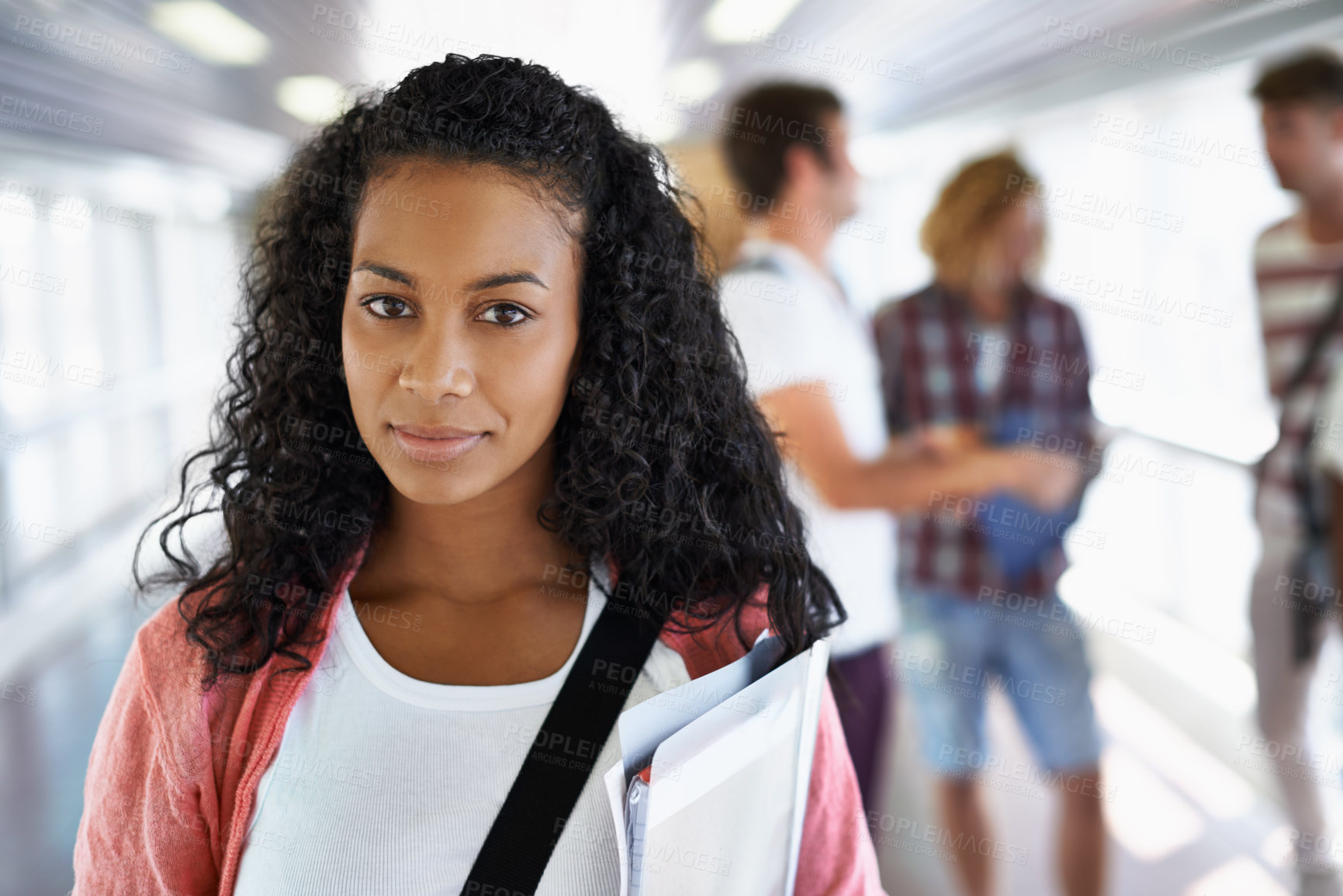 Buy stock photo Portrait of an attractive young student standing with her friends in the background