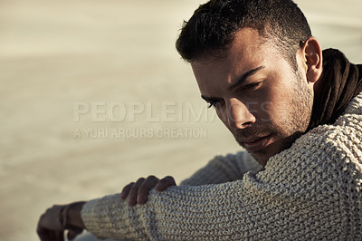Buy stock photo A ruggedly handsome young man enjoying the beach