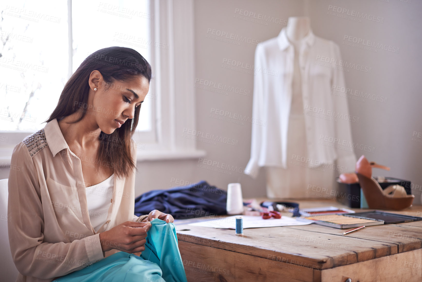 Buy stock photo Shot of a young fashion designer working on a new design