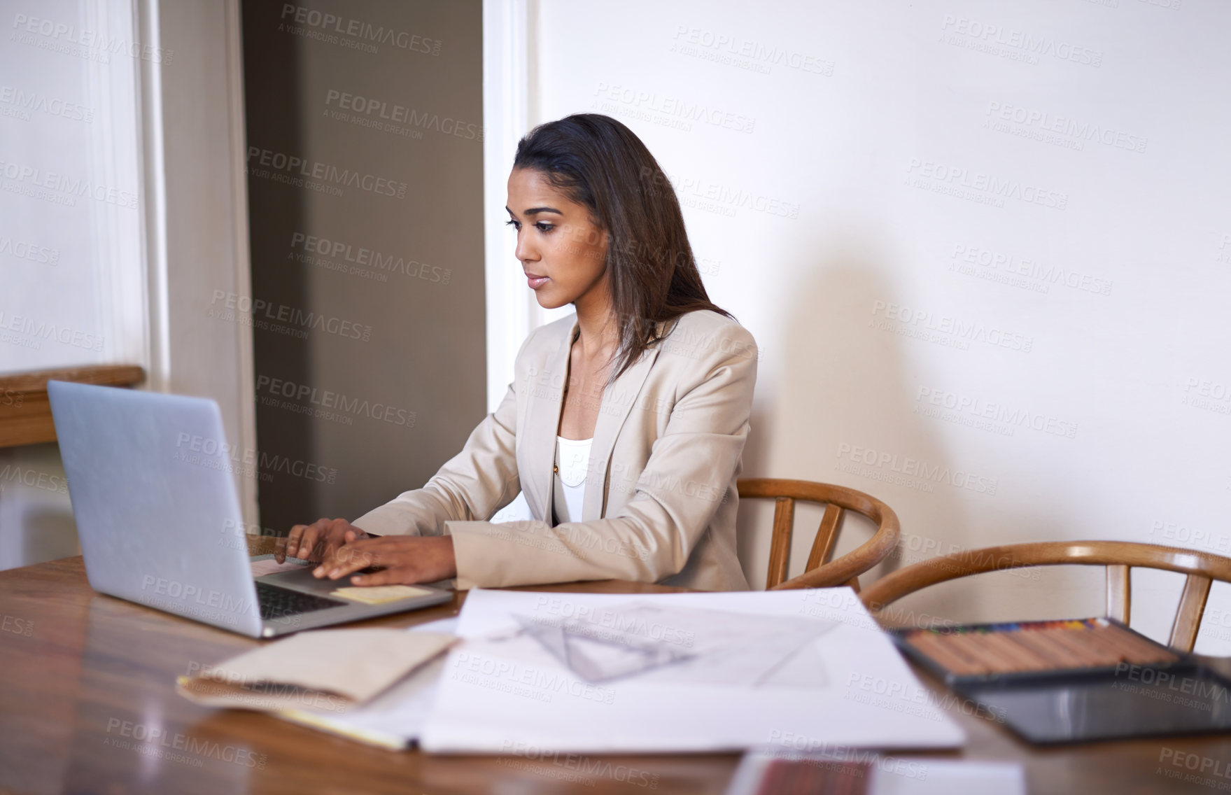 Buy stock photo Black woman, desk and typing on laptop for small business, work from home and thinking of idea to design. African female owner, technology and research for architecture, career and entrepreneur