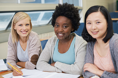 Buy stock photo Woman, students and studying in university lecture hall with notes, prepare and plan for exam. Ideas, smile and focus on plan for determination, knowledge and information for assessment task