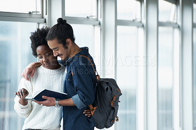 Buy stock photo Couple, university and students with a book, hug and conversation for project and teamwork. College, man and woman with ideas or brainstorming with planning and education with embrace or knowledge