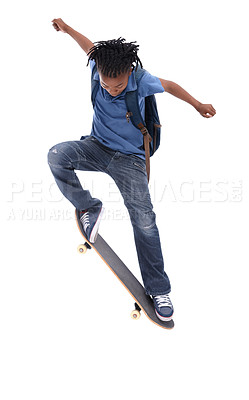 Buy stock photo A young African-American boy doing a trick on his skateboard