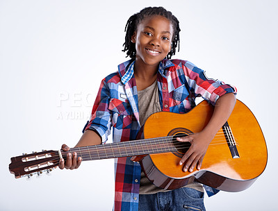 Buy stock photo Studio, portrait or African child with guitar or smile playing song or music isolated on white background. Happy boy, artist or creative kid with acoustic instrument, practice performance or talent