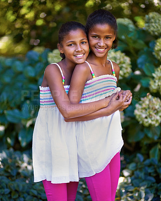 Buy stock photo Friends, children or twin sisters portrait outdoor while playing and happy in nature, backyard or park. Girl kids or family together for hug, trust and love in natural green garden for fun in Jamaica