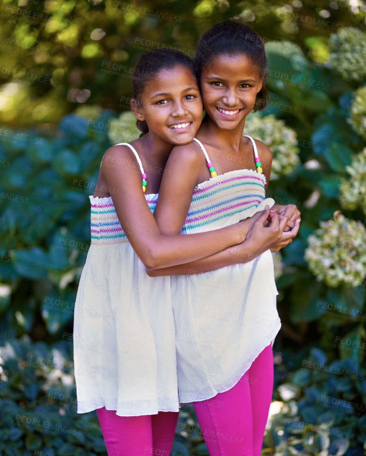 Buy stock photo Friends, children or twin sisters portrait outdoor while playing and happy in nature, backyard or park. Girl kids or family together for hug, trust and love in natural green garden for fun in Jamaica