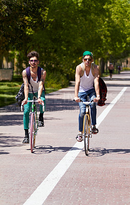 Buy stock photo Bicycle, travel and men friends in a city street riding, bond and enjoying freedom on holiday or vacation together. Cycling, bike and people in a road with freedom, adventure and neighborhood hangout