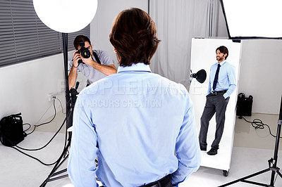 Buy stock photo Photographer, model shoot and camera in studio, behind the scenes and equipment on set for advertising. Man, back and videographer with lens or gear for image, business marketing and corporate design