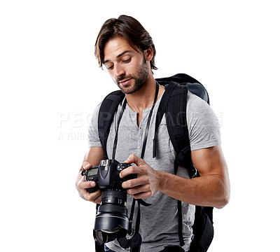 Buy stock photo Man, camera and photography with technology in studio, press or media on white background. Photographer, photo journalist check work and creativity with paparazzi, equipment and backpack in studio