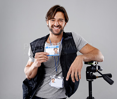 Buy stock photo Man, portrait with press or media, cameraman in studio for interview or news, photographer and ID card on grey background. Photo journalist, reporter or paparazzi, identification and professional 