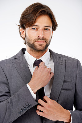 Buy stock photo Businessman, portrait and fashion with tie for style, career ambition or opportunity on a white studio background. Face of handsome man, employee or professional getting ready in suit for business