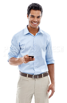 Buy stock photo Studio shot of a young man text messaging isolated on white