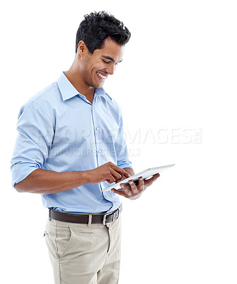 Buy stock photo Studio shot of a handsome young man using a digital tablet isolated on white