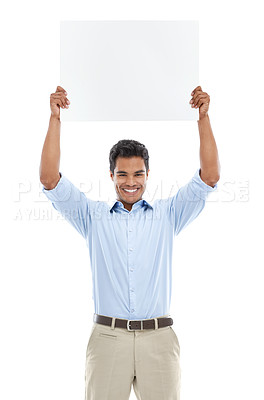 Buy stock photo Studio shot of a young man holding a blank card for copyspace isolated on white