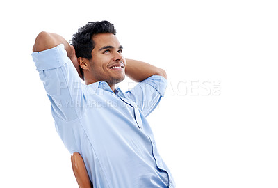 Buy stock photo Studio shot of a handsome young man sitting in a studio isolated on white