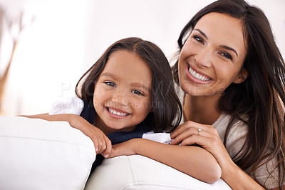 Buy stock photo Happy mother, portrait and hug with child on sofa for love, bonding or care together at home. Face of mom, parent and little girl, daughter or kid smile in living room for family weekend or support