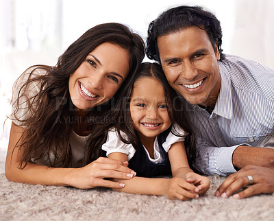 Buy stock photo Cropped portrait of an affectionate young family at home