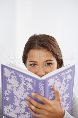 Buy stock photo Woman, portrait and happy with book on mockup space for reading, learning information and knowledge in studio. Indian person, face and smile with novel for literature, scholarship or white background