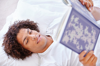 Buy stock photo Man, bed and reading book for literature, knowledge and fantasy novel or information at home. Male person, student and story for education and comfortable, learning and studying fiction to relax