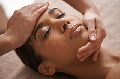 Buy stock photo Shot of a beautiful young woman getting a head massage at a spa